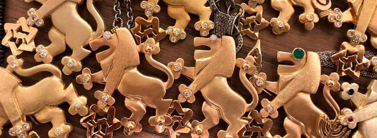 Lion of Judah pins on a table