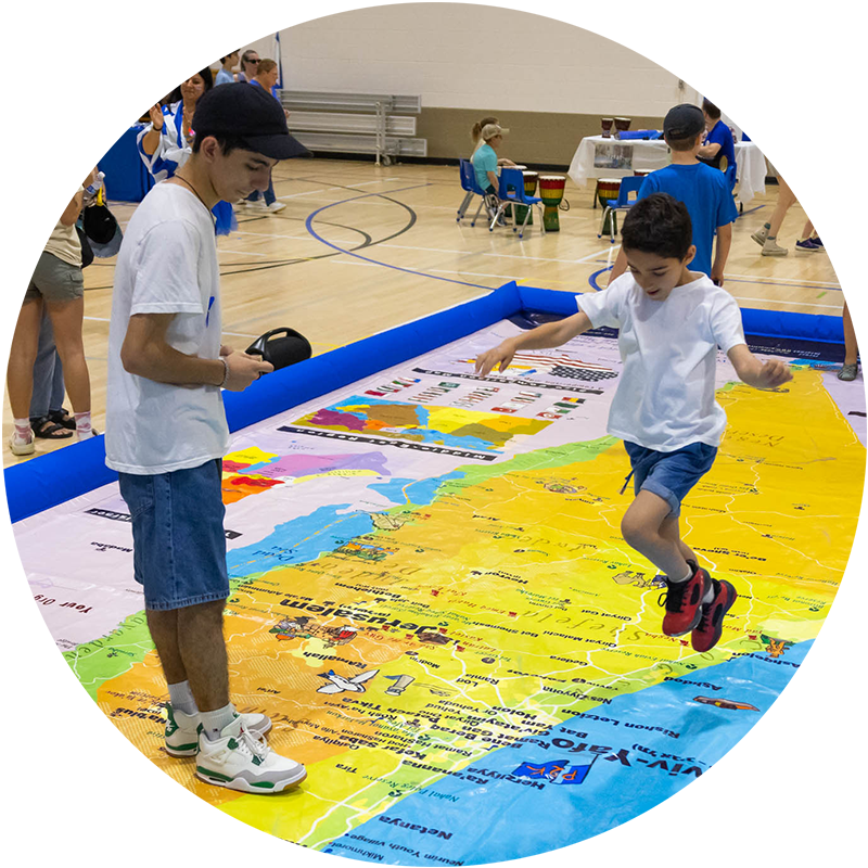 kids on giant map of Israel