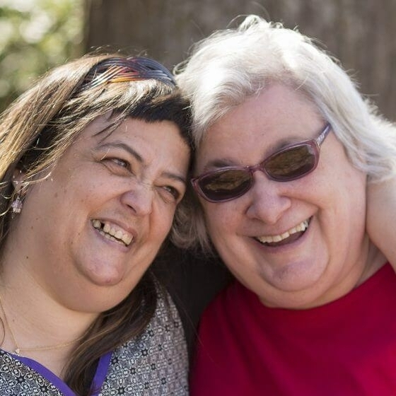 Two people smiling