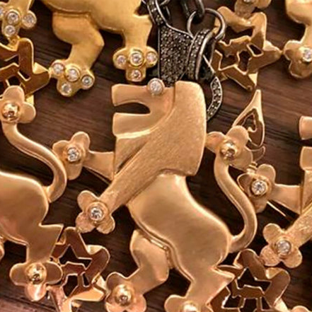 Lion of Judah pins on a table