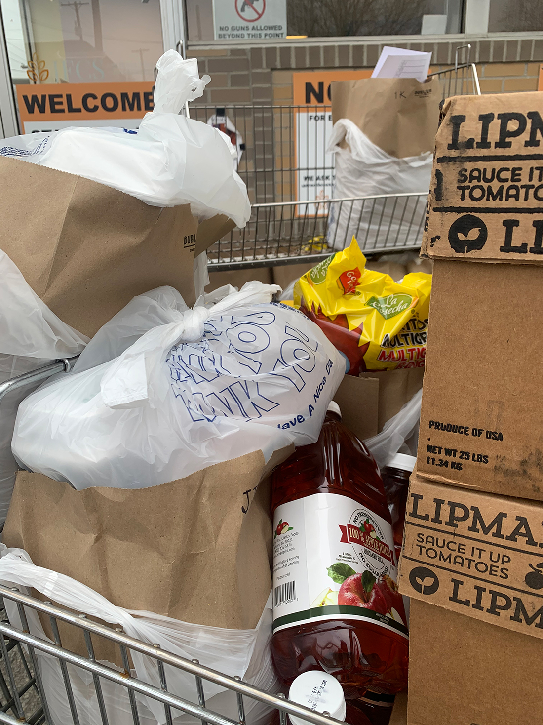 Groceries in a shopping cart ready for delivery