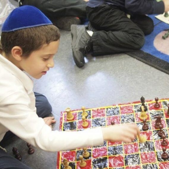 Boy playing checkers